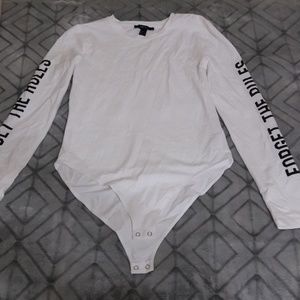 A long sleeve body suit